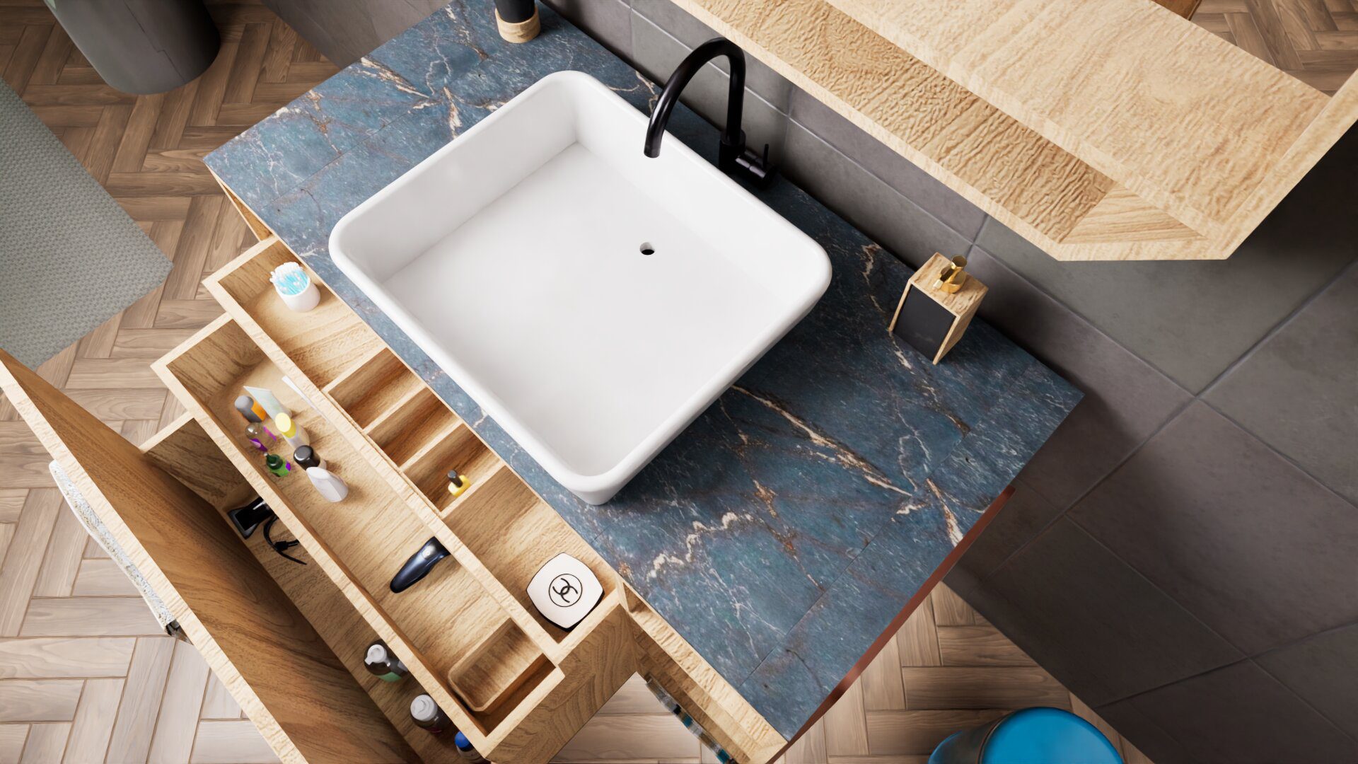 3.Top_V2 A modern bathroom sink with a square white basin, black faucet, blue marble countertop, and open wooden drawers containing toiletries.